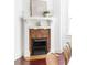 Charming vintage fireplace with decorative white mantel, tile surround, and decorative accents at 118 Waverly Way, Atlanta, GA 30307
