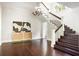 Spacious foyer with hardwood floors, staircase, chandelier, and elegant decor at 118 Waverly Way, Atlanta, GA 30307