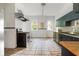 Spacious kitchen with tile floors, stainless steel appliances, and white subway tile backsplash at 118 Waverly Way, Atlanta, GA 30307