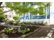 Charming landscaped yard with lush greenery, stone walkways, and mature trees providing shade at 118 Waverly Way, Atlanta, GA 30307
