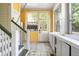 Mud room with yellow walls, white trim, and tile floors at 118 Waverly Way, Atlanta, GA 30307