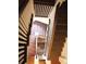 Dramatic staircase features wood treads and railings, painted risers and trim, and architectural details at 118 Waverly Way, Atlanta, GA 30307