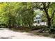 Serene street view showcasing a well-maintained home, mature trees, and sidewalks at 118 Waverly Way, Atlanta, GA 30307