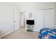 Comfortable bedroom with carpet, natural light, television, closet and a daybed at 11865 Brisbane Dr, Alpharetta, GA 30009