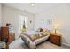 Tranquil bedroom with carpet, a bed with a quilt, and warm lighting from bedside lamps at 11865 Brisbane Dr, Alpharetta, GA 30009