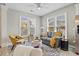 Bright and airy living room featuring hardwood floors, large windows, and comfortable seating arrangements at 11865 Brisbane Dr, Alpharetta, GA 30009