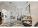 Open-concept living room with hardwood floors, fireplace, and comfortable seating, great for entertaining guests at 11865 Brisbane Dr, Alpharetta, GA 30009