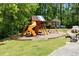 Community playground with slide, swings, and plenty of space for fun at 11865 Brisbane Dr, Alpharetta, GA 30009
