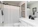 Charming bathroom with coastal decor, white vanity, and striped shower curtain at 1717 Cosette Ln, Kennesaw, GA 30152