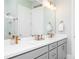 Well-lit bathroom with double vanity, modern fixtures, and a marble-tiled shower at 1717 Cosette Ln, Kennesaw, GA 30152
