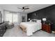 Stylish bedroom featuring a modern accent wall, natural light, and cozy seating at 1717 Cosette Ln, Kennesaw, GA 30152