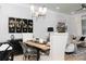 Elegant dining area with stylish lighting, contemporary decor, and seamless flow to the living space at 1717 Cosette Ln, Kennesaw, GA 30152