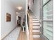 Inviting entryway with wood floors, staircase, decorative rug, and an open door to welcome guests at 1717 Cosette Ln, Kennesaw, GA 30152