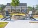 Cozy outdoor firepit area with Adirondack chairs, offering a great space for gatherings and relaxation at 1717 Cosette Ln, Kennesaw, GA 30152