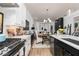 Bright kitchen with modern appliances and a seamless flow to the dining and living areas at 1717 Cosette Ln, Kennesaw, GA 30152