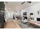 Bright, open-concept living room and kitchen area with modern lighting and stylish decor at 1717 Cosette Ln, Kennesaw, GA 30152