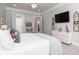Bright main bedroom featuring a large bed, modern decor, and an ensuite bathroom at 1717 Cosette Ln, Kennesaw, GA 30152