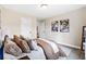 Comfortable bedroom with plush pillows and ensuite bathroom entrance at 209 Starr Cir, Stockbridge, GA 30281