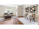 Stylish living area showcasing hardwood floors, modern decor, and ample natural light, creating a welcoming and vibrant space at 209 Starr Cir, Stockbridge, GA 30281