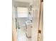 Cozy, all white bathroom with sliding door shower at 3385 Martin Luther King Jr Sw Dr, Atlanta, GA 30331