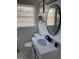 Bright bathroom with vanity, mirror and natural light from window at 3385 Martin Luther King Jr Sw Dr, Atlanta, GA 30331