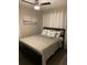Cozy bedroom features a ceiling fan, neutral walls, and modern decor at 3385 Martin Luther King Jr Sw Dr, Atlanta, GA 30331