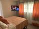 Bedroom with a comfortable bed, flat screen TV, bright lighting, and stylish decor at 3385 Martin Luther King Jr Sw Dr, Atlanta, GA 30331