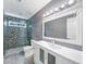 An updated bathroom includes a sleek vanity and glass enclosed shower at 395 Clubfield Dr, Roswell, GA 30075