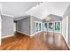 Elegant sunroom with hardwood floors, cathedral ceilings, chandelier, and large windows offering natural light at 395 Clubfield Dr, Roswell, GA 30075