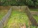 Aerial view of fully fenced-in backyard with healthy green grass and privacy at 106 Trailside Way, Hiram, GA 30141
