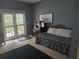 Comfortable bedroom with doors to private outdoor space at 106 Trailside Way, Hiram, GA 30141