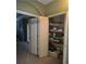Bedroom closet with shelving, storage solutions, and bifold doors at 106 Trailside Way, Hiram, GA 30141