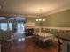 Open-concept dining area with a fireplace and hardwood floors, perfect for gatherings and Gathering meals at 106 Trailside Way, Hiram, GA 30141