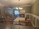 Dining area includes a fireplace and leads to the living room and stairs at 106 Trailside Way, Hiram, GA 30141