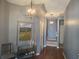 Stylish foyer with hardwood floors, decorative lighting, and neutral paint palette at 106 Trailside Way, Hiram, GA 30141