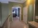 View down the hallway, with walls painted a shade of green, showing a view into a bedroom at 106 Trailside Way, Hiram, GA 30141