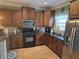 Well-equipped kitchen with stainless steel appliances, stylish cabinets, and granite countertops at 106 Trailside Way, Hiram, GA 30141