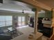 Open-concept living room with fireplace, bright light and beautiful architectural details at 106 Trailside Way, Hiram, GA 30141