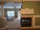 Inviting living room with fireplace, arched doorway, and lots of natural light at 106 Trailside Way, Hiram, GA 30141