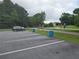 Well-maintained parking lot with marked spaces, surrounded by lush greenery and trees at 106 Trailside Way, Hiram, GA 30141