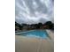 Community pool area with surrounding greenery offering a refreshing escape at 106 Trailside Way, Hiram, GA 30141