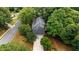 Aerial view of a gray shingled home with a driveway and a two car garage at 1061 Polo Club Nw Dr, Marietta, GA 30064