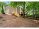 Spacious backyard with stairs leading to a deck, offering outdoor enjoyment and privacy at 1061 Polo Club Nw Dr, Marietta, GA 30064