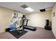 Workout area featuring a treadmill, weight machine, and punching bag in a finished basement at 1061 Polo Club Nw Dr, Marietta, GA 30064