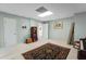 Finished basement featuring neutral walls, bookcase, chest, and access to adjoining rooms at 1061 Polo Club Nw Dr, Marietta, GA 30064