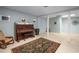 Spacious finished basement featuring a piano, rug, and accent chair with neutral color palette at 1061 Polo Club Nw Dr, Marietta, GA 30064