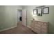 Bright bedroom shows dresser and furnishings plus open door to adjoining room at 1061 Polo Club Nw Dr, Marietta, GA 30064