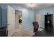 Light blue bedroom features a desk and chair and two different entry points at 1061 Polo Club Nw Dr, Marietta, GA 30064