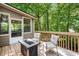 Relaxing outdoor deck with seating and a tranquil wooded view, perfect for enjoying nature at 1061 Polo Club Nw Dr, Marietta, GA 30064