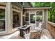 Cozy outdoor deck with comfortable seating and a charming view of the surrounding nature at 1061 Polo Club Nw Dr, Marietta, GA 30064